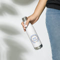 Product Stainless steel water bottle from SCD One with a hand holding the water bottle donning the design