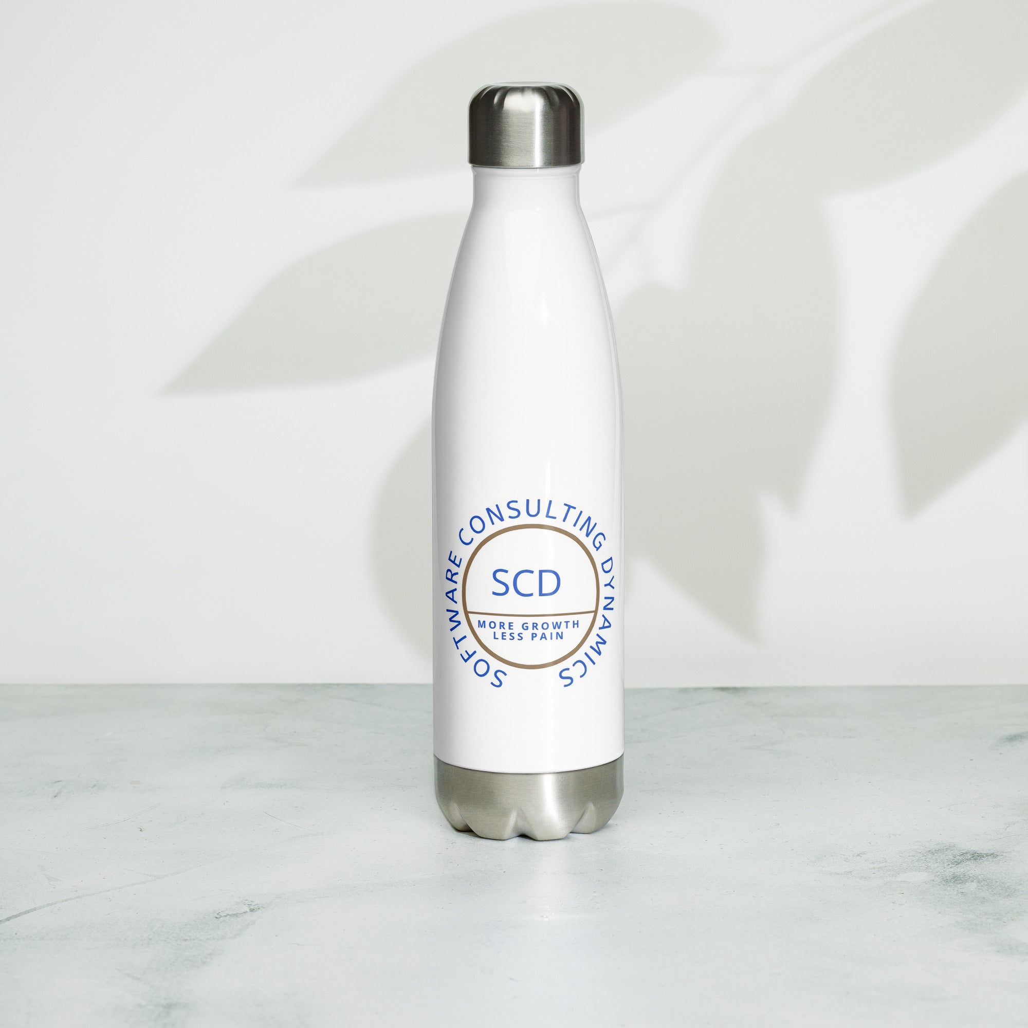 Stainless steel water bottle from SCD One resting on a flat surface sitting upright donning the design