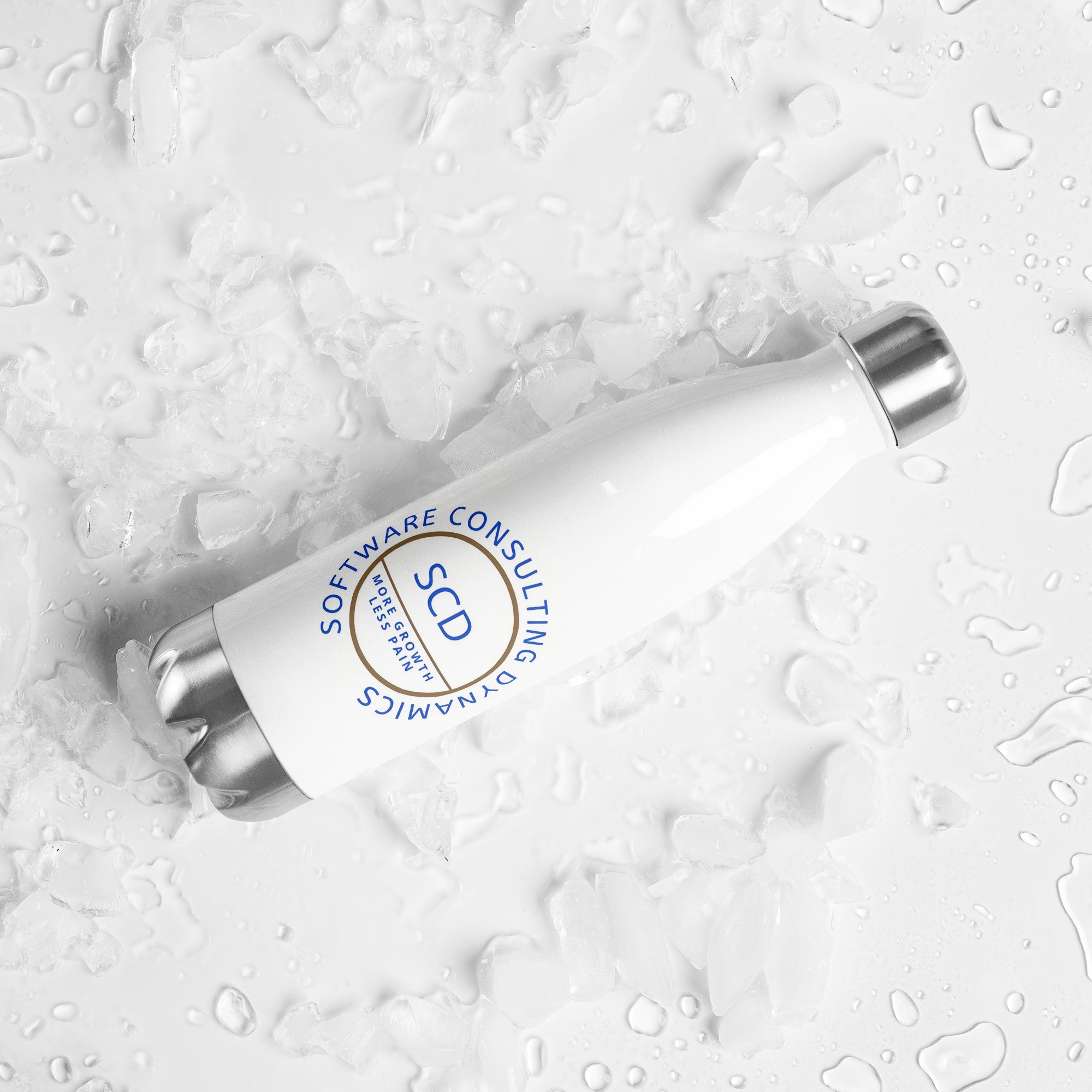 Stainless steel water bottle from SCD One laying on a flat surface with a right tilt