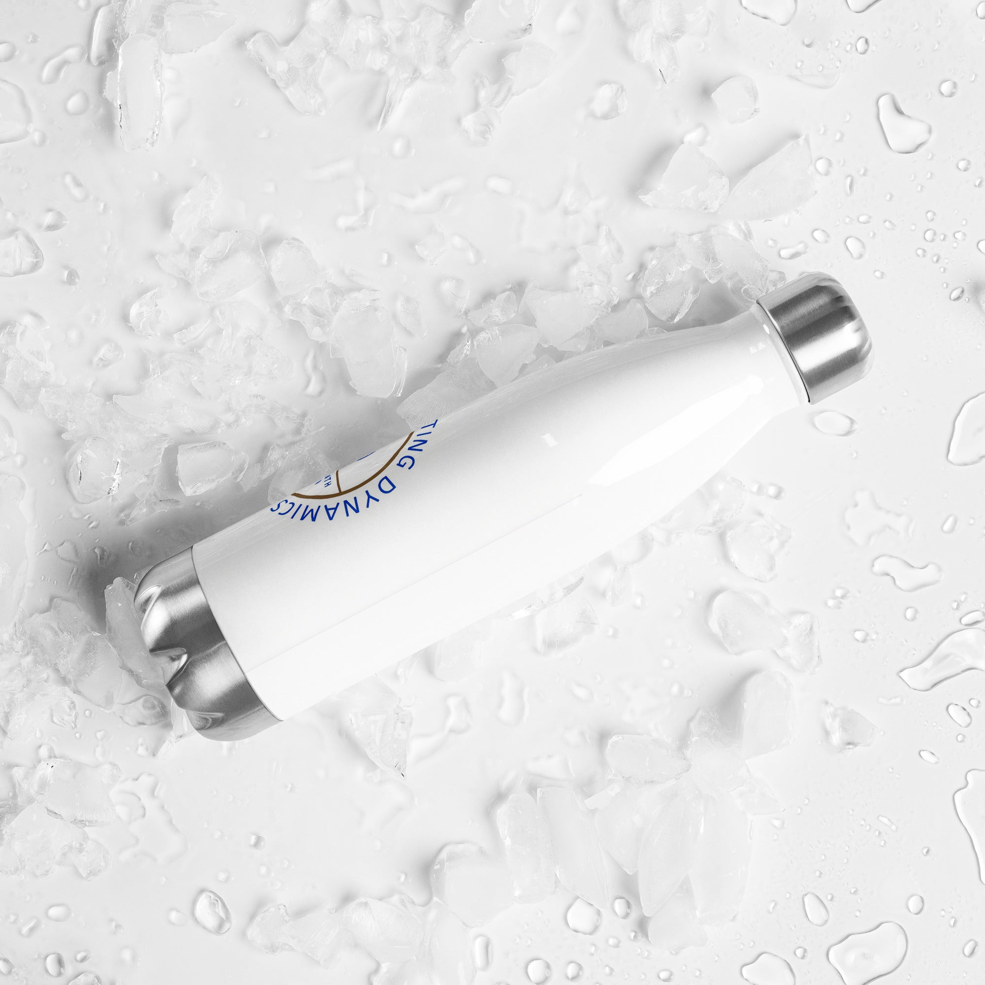 Stainless steel water bottle from SCD One laying on a flat surface with a back right tilt